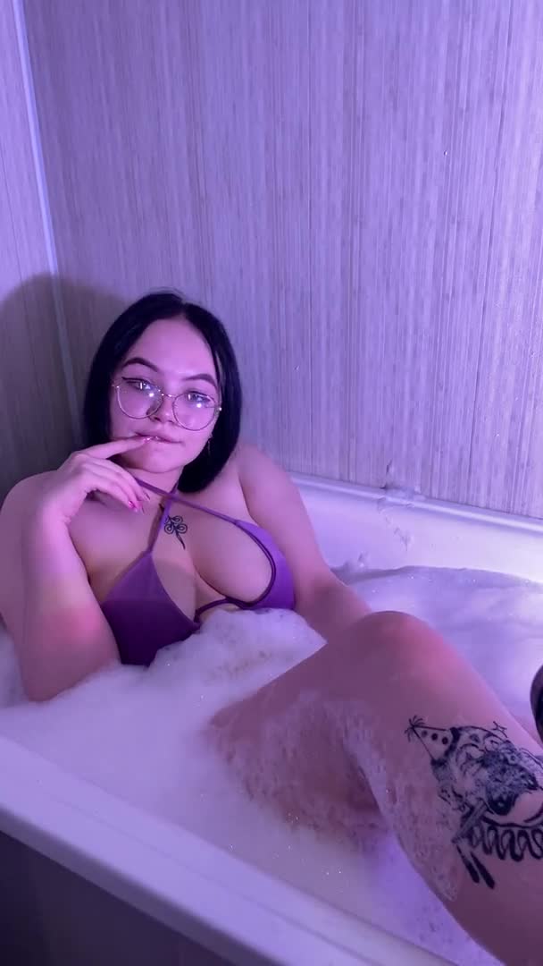 In a bath with foam in a swimsuit &mdash; clip by A1ka